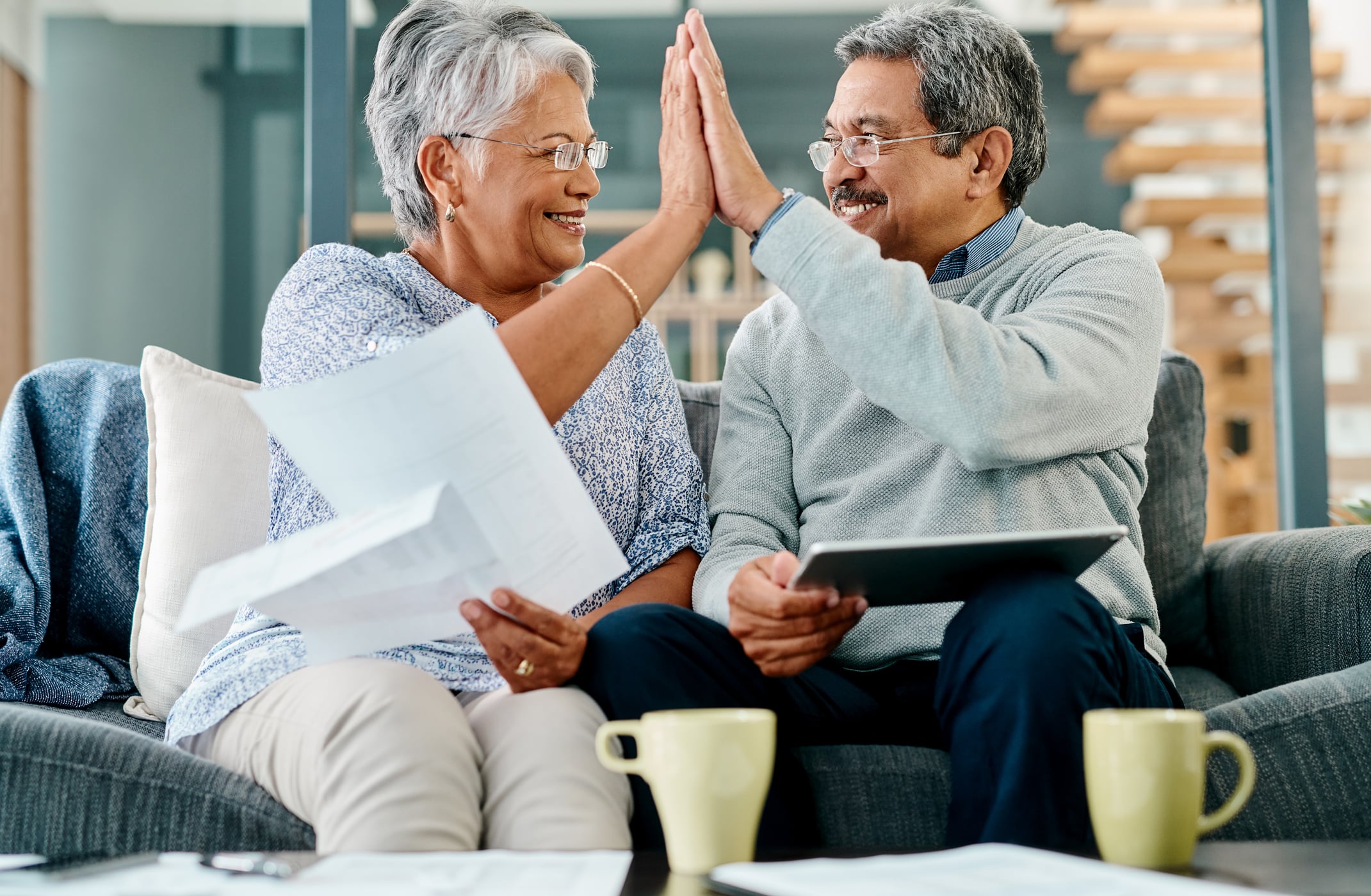 Missouri Gold IRA Investing Company getty couple high five happy